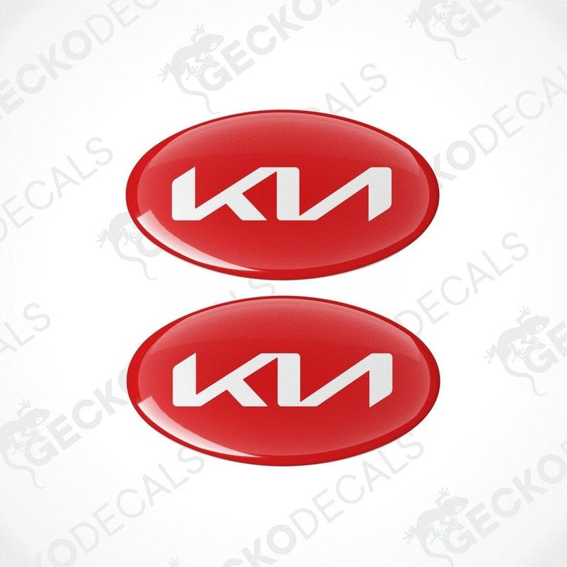 Two red oval-shaped vinyl decals with the KIA logo in white.