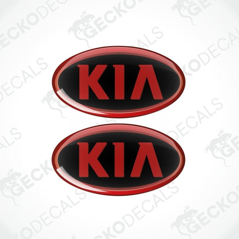 Two red and black vinyl stickers with the KIA brand logo in the center.