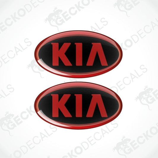 Two red and black vinyl stickers with the KIA brand logo in the center.