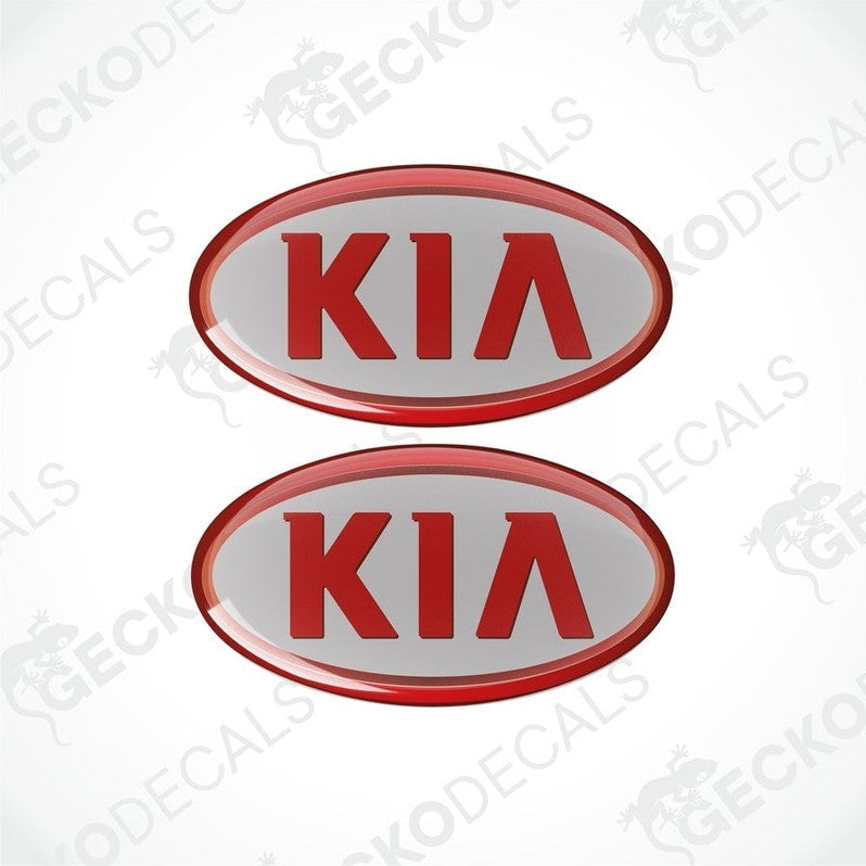 Two red and grey stickers with the KIA brand logo in the center.