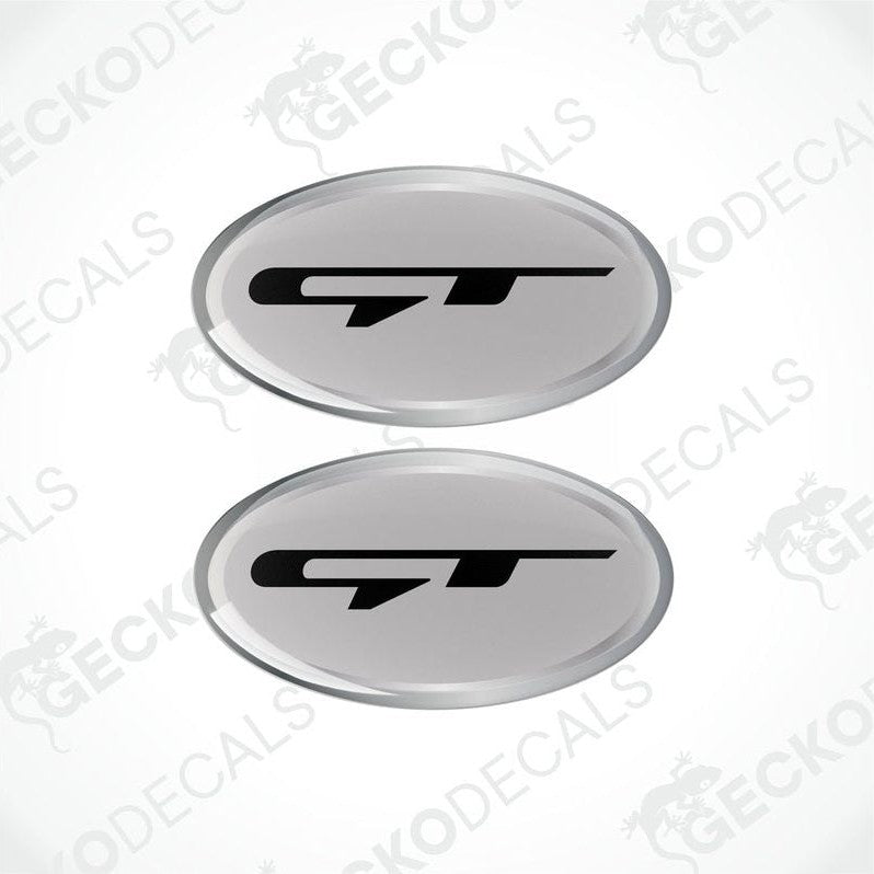 Two grey,black, and silver car decals with the GT logo.