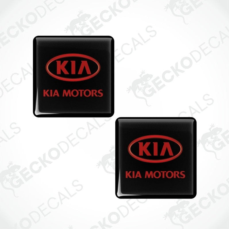 Two black Kia Motors logo stickers on a white background with 'Gecko Decals' branding.