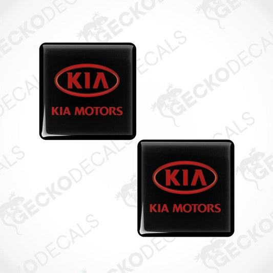 Two black Kia Motors logo stickers on a white background with 'Gecko Decals' branding.