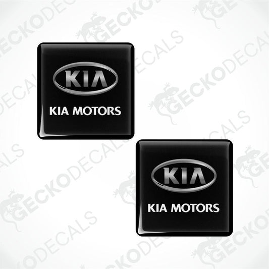 Two black Kia Motors logo stickers on a white background with 'Gecko Decals' branding.