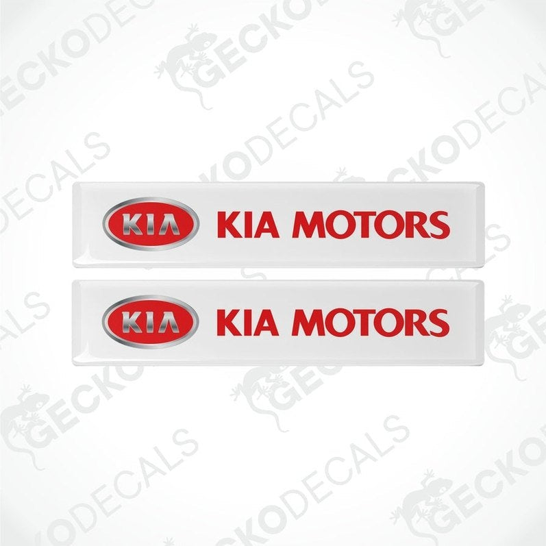 Two white vinyl stickers with the Kia Motors logo in red and white.