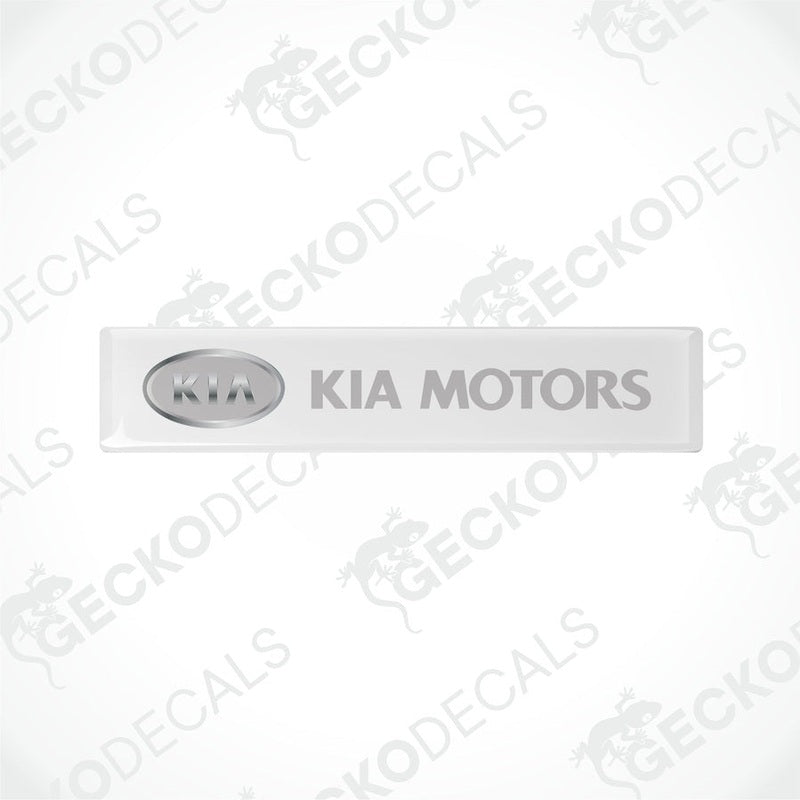  White rectangular car decals with 'KIA MOTORS' written in grey text.