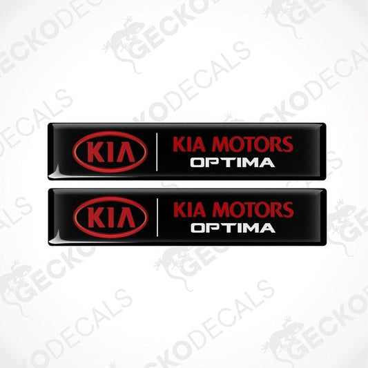 Two black vinyl decals with red text 'KIA MOTORS OPTIMA' on a white background.