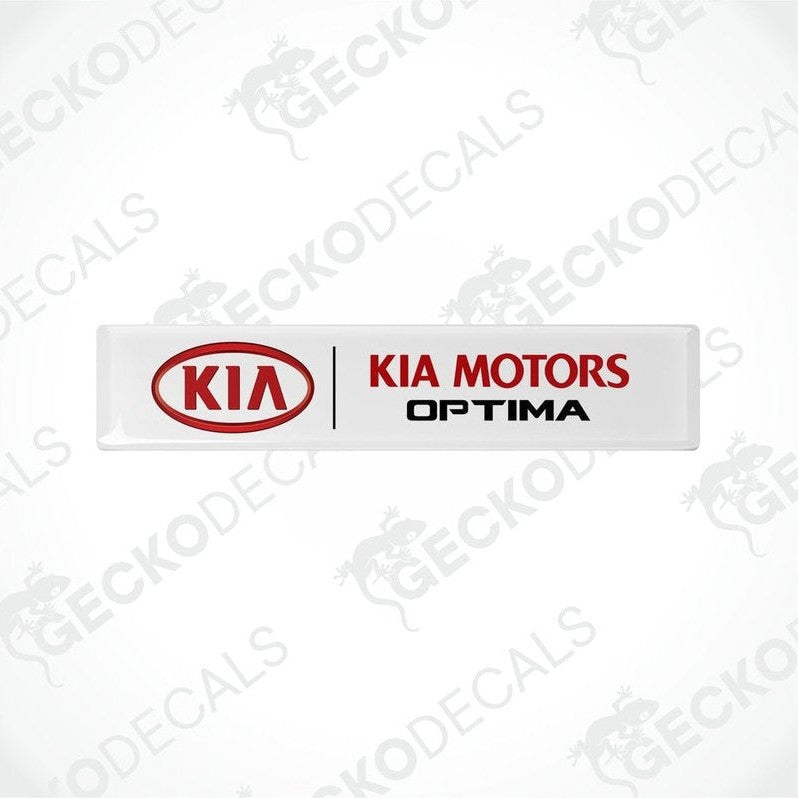 White vinyl decals with red text 'KIA MOTORS OPTIMA' on a white background.