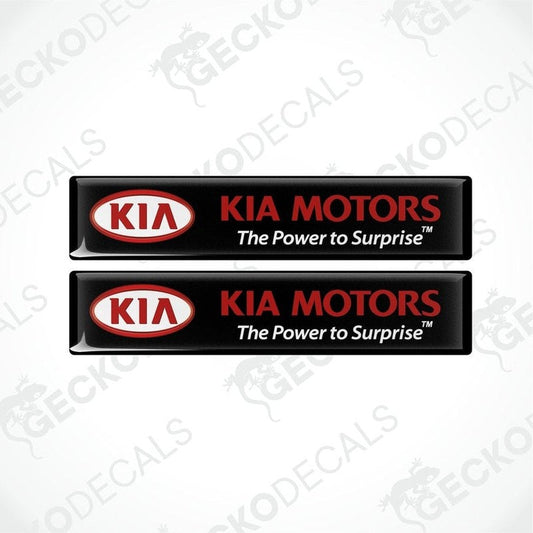 Two black vinyl stickers with the Kia Motors logo in red and white.