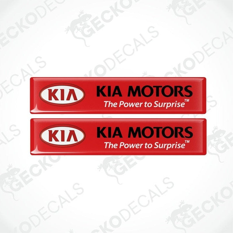 Two red vinyl stickers with the Kia Motors logo in red and black.