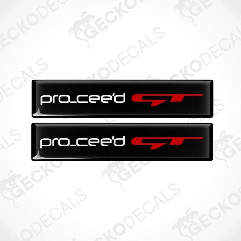 Two black vinyl stickers with the text 'PRO CEED GT' in red and white, placed against a white background.