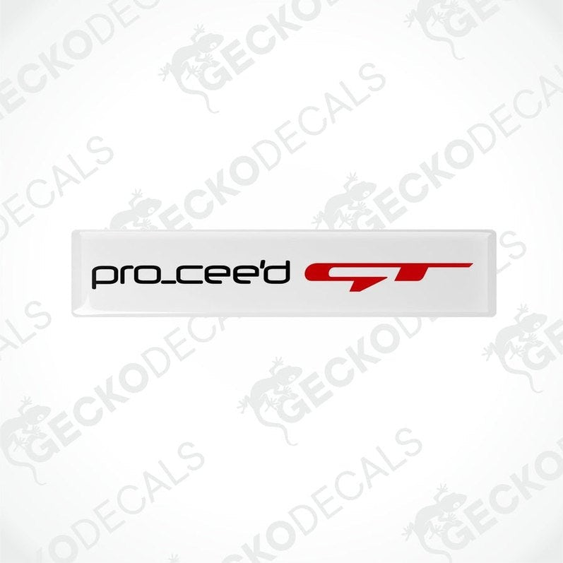 Two white vinyl stickers with the text 'PRO CEED GT' in red and black placed against a white background.