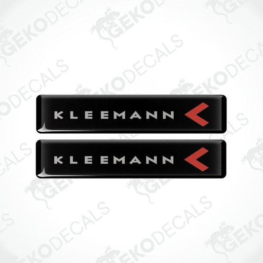 Two black vinyl decals with the text 'KLEEMANN' and a red arrow symbol on them.