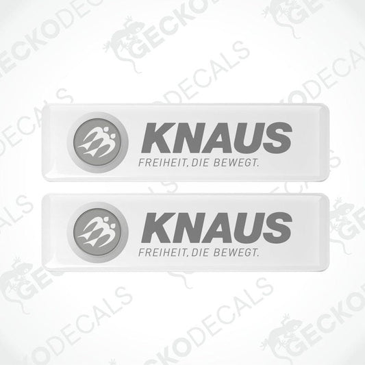 Two white rectangular epoxy decals with the text 'KNAUS FREIHEIT. DIE BEWEGT.' and the logo of KNAUS brand.