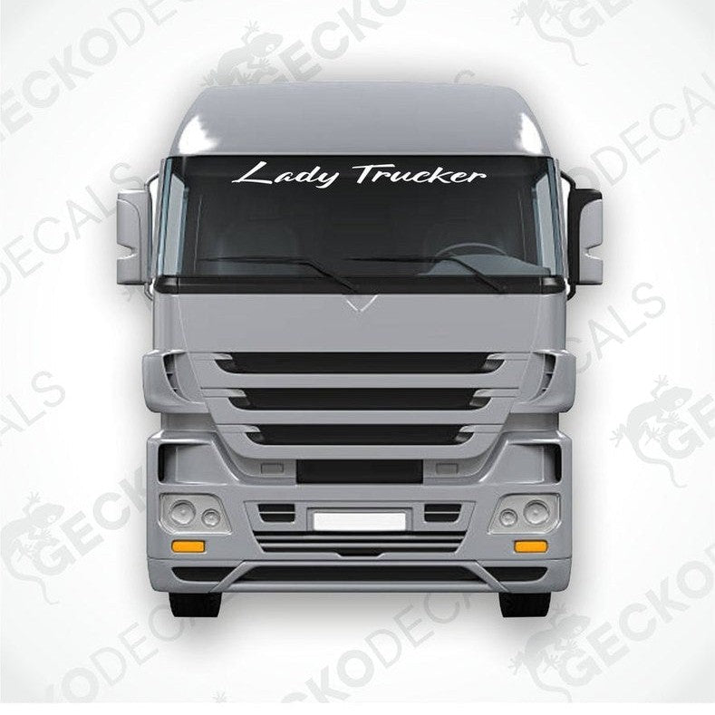 A decal with the text 'Lady Trucker' displayed on the windshield of a gray truck.