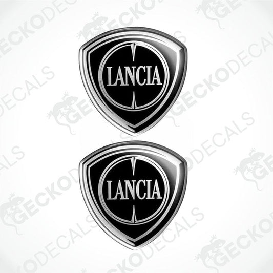 Two silver and black vinyl decals with the LANCIA brand logo.