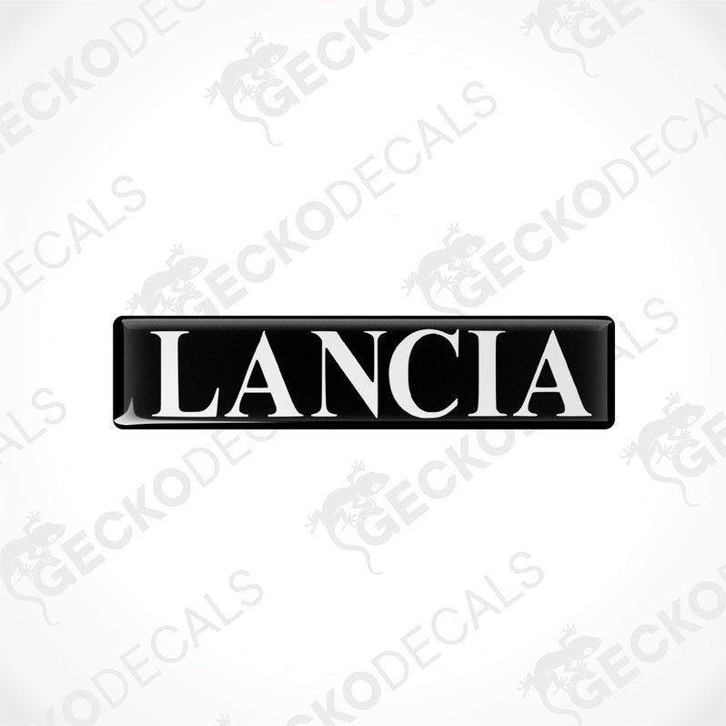 Rectangular black vinyl decals with the word 'LANCIA' written in white letters.