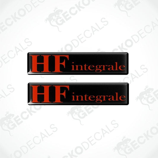 Two rectangular black vinyl decals with the word 'LANCIA HF INTEGRALE' written in red letters.