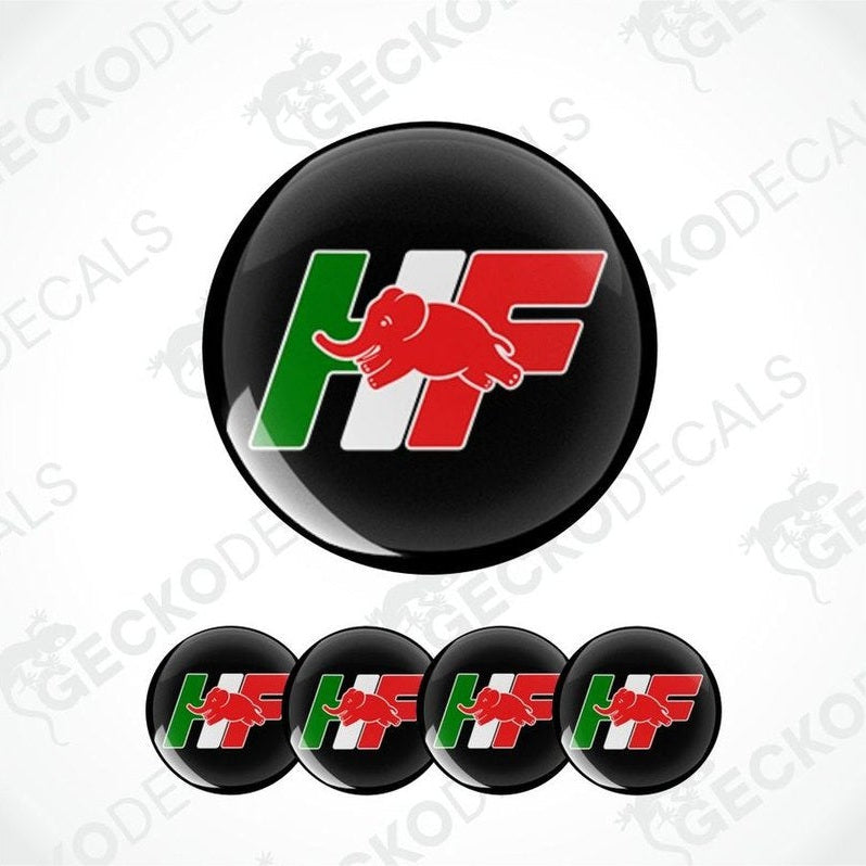 Black round decal with red, green, and white logo on a white background.