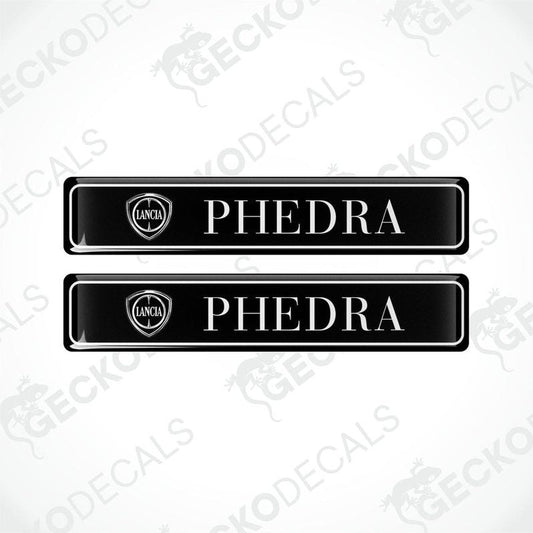 Two black vinyl stickers with the word 'LANCIA' and 'PHEDRA' branded on them, placed against a white background with the GeckoDecals logo.