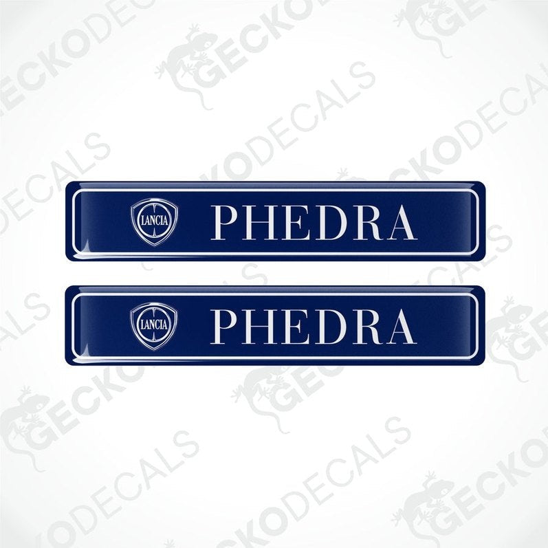 Two blue vinyl stickers with the word 'LANCIA' and 'PHEDRA' branded on them, placed against a white background with the GeckoDecals logo.