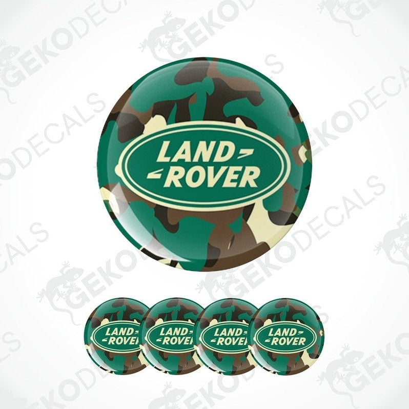 A set of four round car decals with a camouflage pattern and the Land Rover logo in the center.