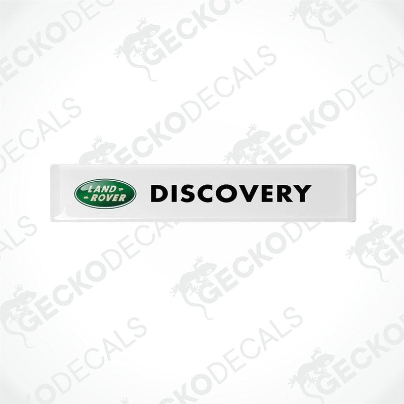 White vinyl decals with the text 'DISCOVERY' and the Land Rover logo in green and black.