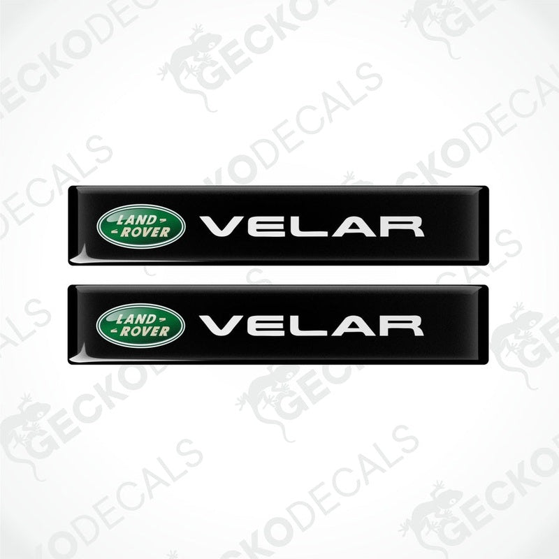 Two black vinyl stickers with the Land Rover Velar brand logo.
