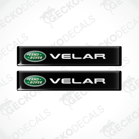 Two black vinyl stickers with the Land Rover Velar brand logo.