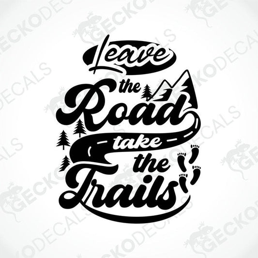A black die cut sticker with the text 'LEAVE THE ROAD TAKE THE TRAILS' and a graphic of a road with tree and mountain design.