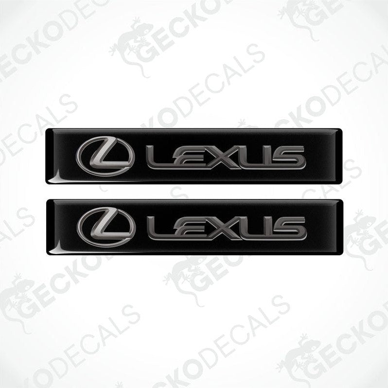 Two black vinyl stickers with the Lexus brand logo on them.