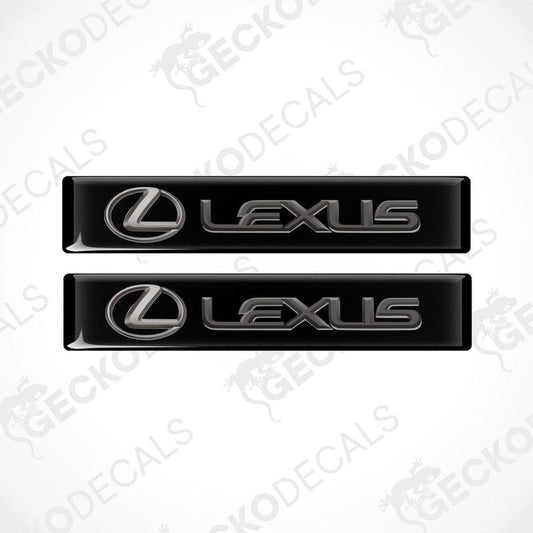 Two black vinyl stickers with the Lexus brand logo on them.