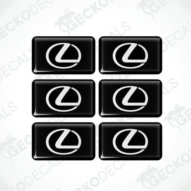 A set of six black and white vinyl decals with the LEXUS logo.