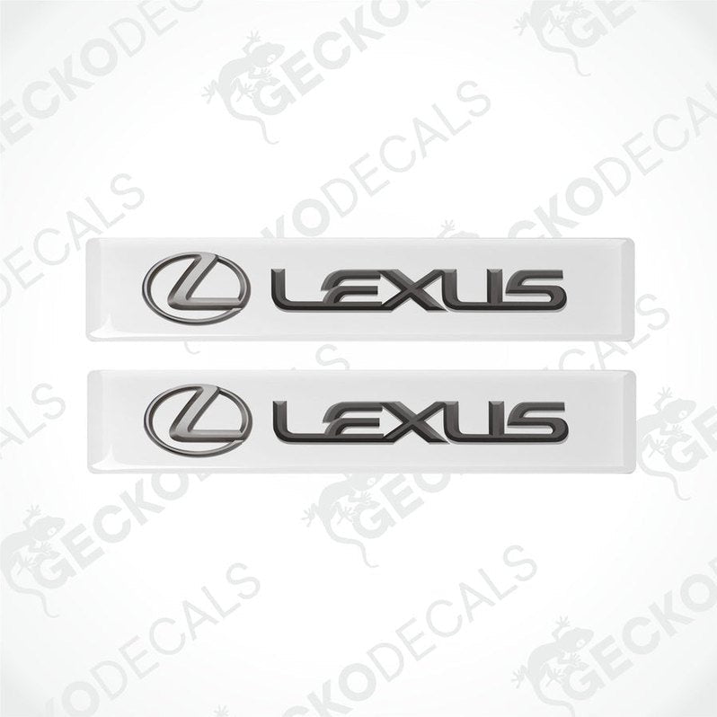 Two white vinyl stickers with the Lexus brand logo on them.