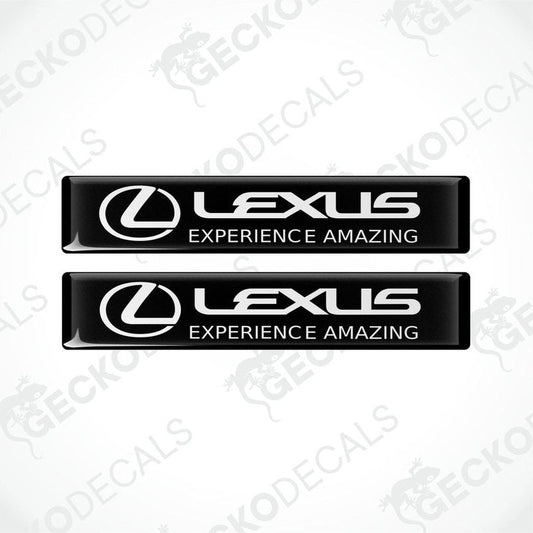 Two rectangular black vinyl decals with the Lexus logo and the phrase 'LEXUS EXPERIENCE AMAZING' written in white.
