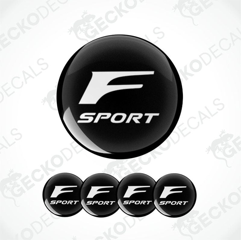A set of black and white 'F SPORT' branded vinyl decals for vehicles, including four dome-shaped stickers.