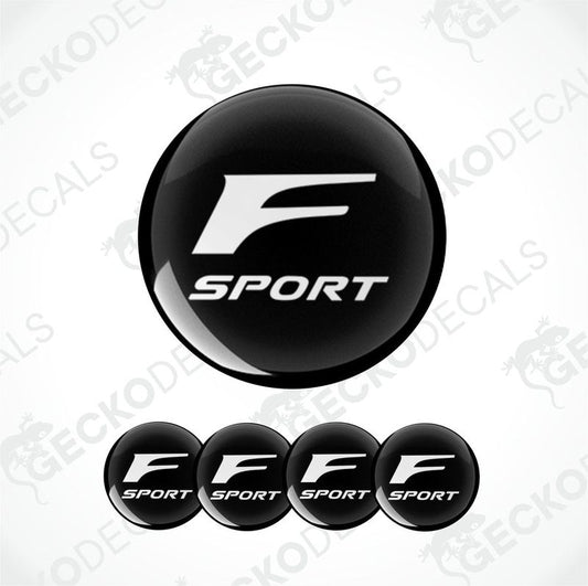 A set of black and white 'F SPORT' branded vinyl decals for vehicles, including four dome-shaped stickers.