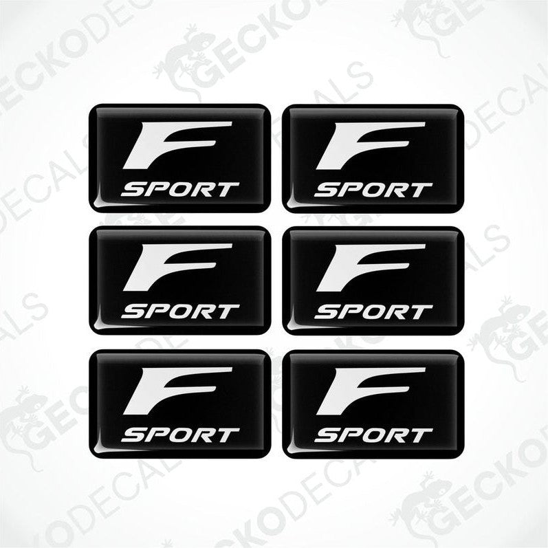 A set of six black vinyl stickers with the Lexus F Sport logo printed on them.