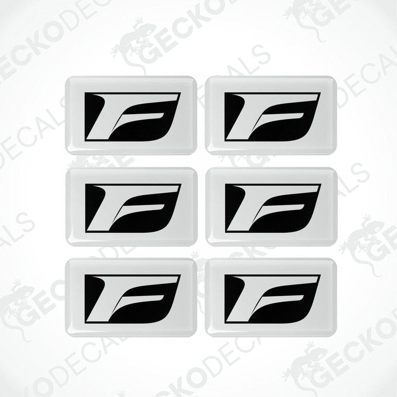 A set of six white vinyl stickers with the Lexus F Sport logo printed on them.