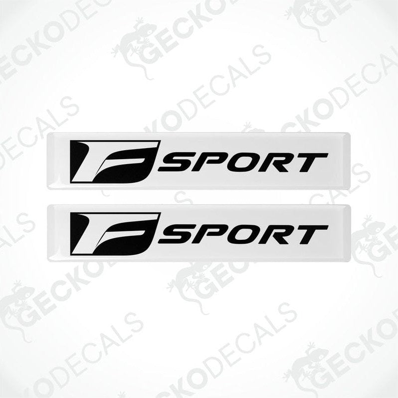 Two white vinyl stickers with the Lexus F Sport logo on a white background.