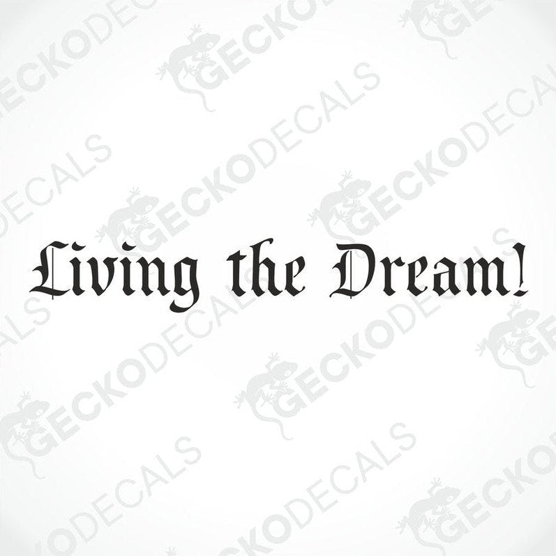 A decal with the phrase 'Living the Dream!' displayed on the windscreen of a truck.