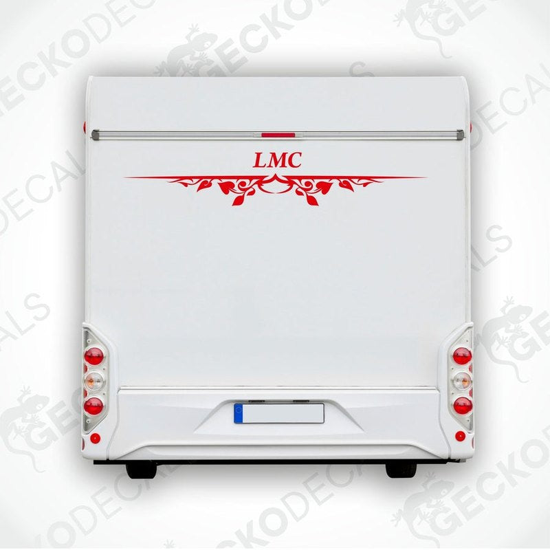 A white caravan with a red LMC decal and decorative elements on the rear side.