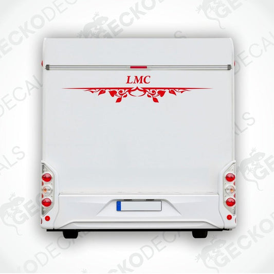 A white caravan with a red LMC decal and decorative elements on the rear side.