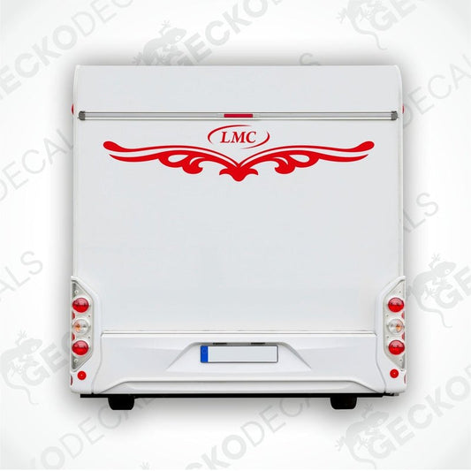 A white caravan with a red LMC decal and decorative elements on the rear side.