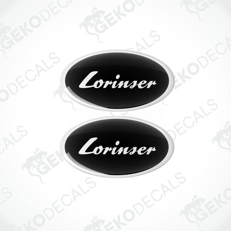 Two black oval-shaped vinyl decals with the white text 'Lorinser' on them.