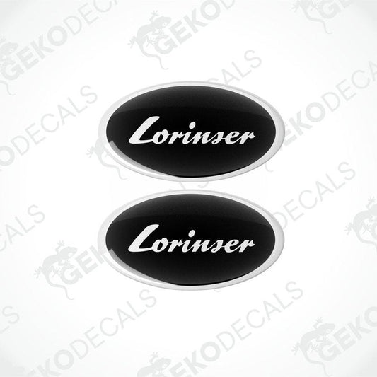 Two black oval-shaped vinyl decals with the white text 'Lorinser' on them.