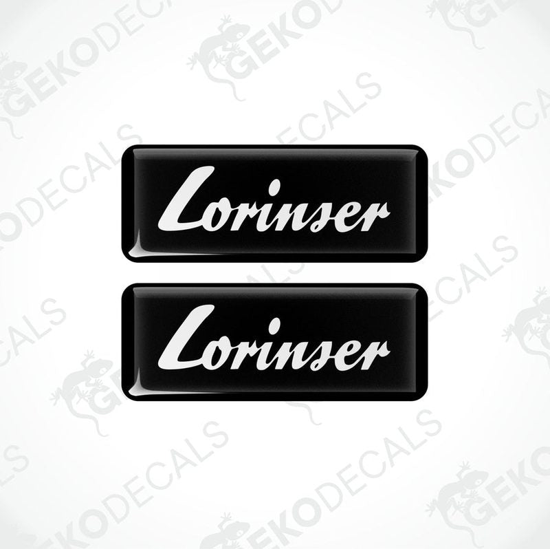 Two black and white rectangular car decals with the text 'Lorinser' on them.