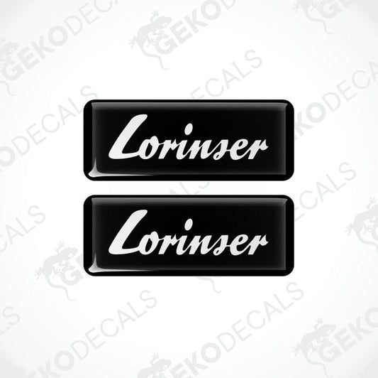 Two black and white rectangular car decals with the text 'Lorinser' on them.
