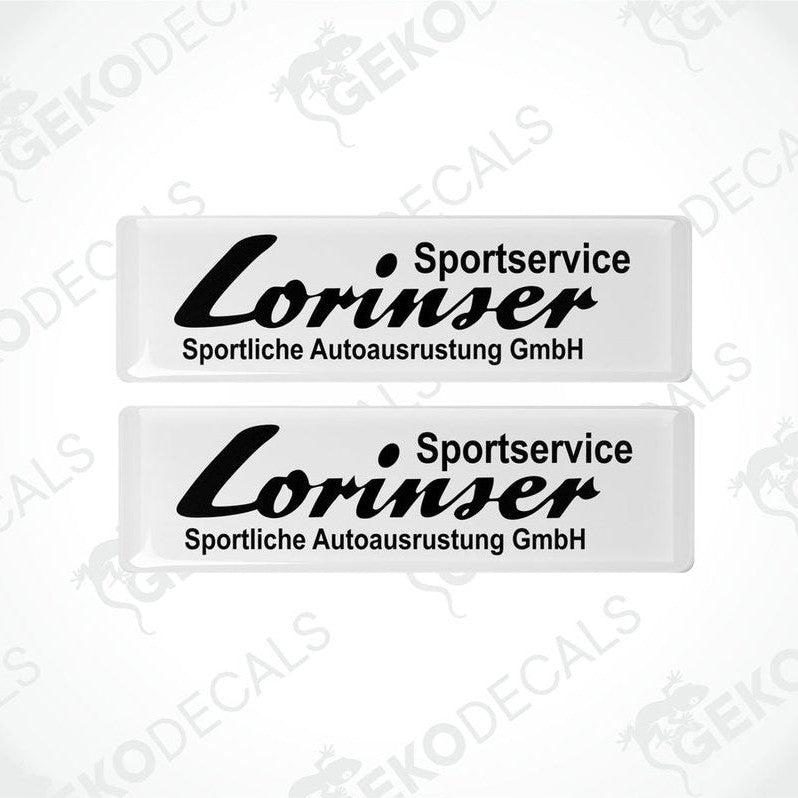 Two white vinyl decals with black text that read 'Lorinser Sportservice Sportliche Autoausrustung GmbH'.