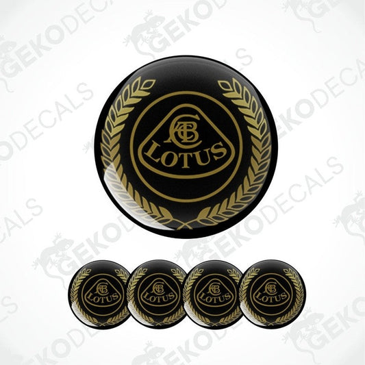 A set of four black and gold vinyl decals with the LOTUS logo applied on a black background.